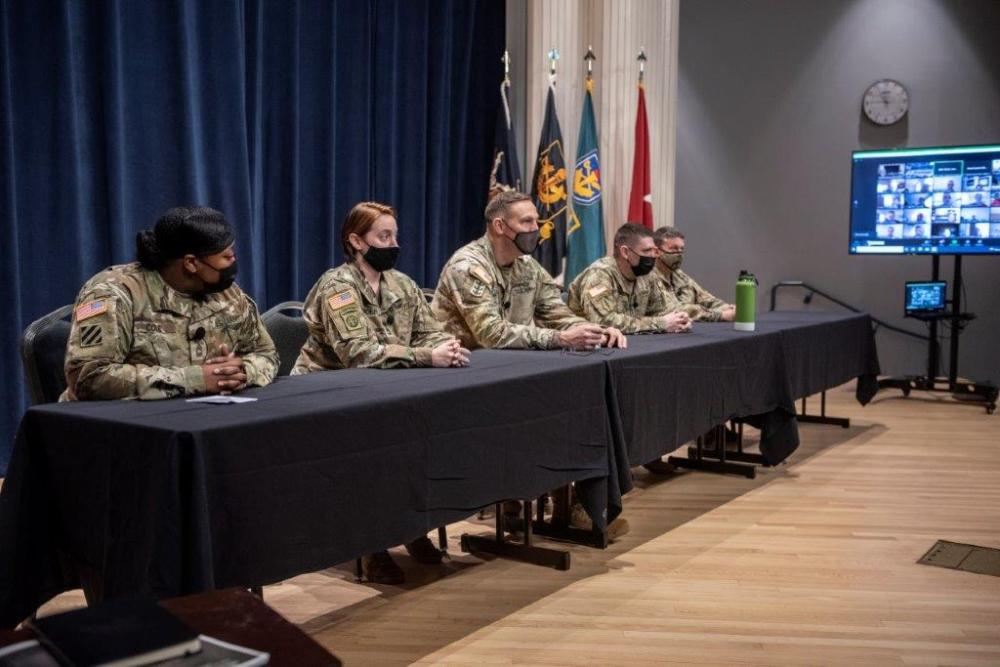 Soldiers sitting at a conference